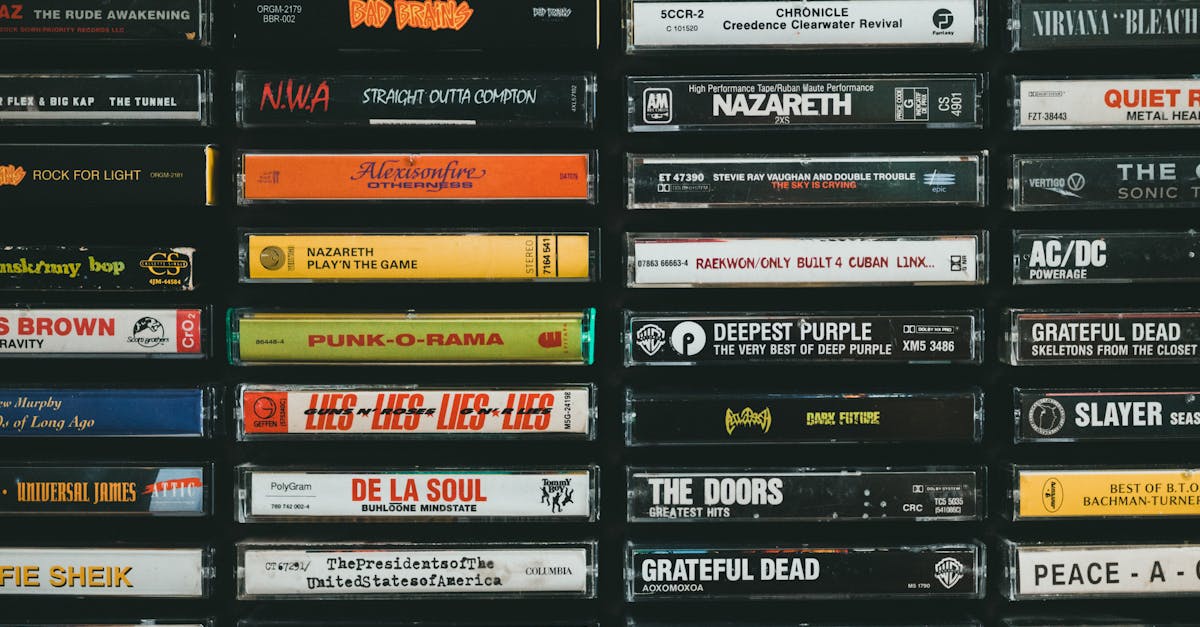 A nostalgic display of vintage cassette tapes featuring iconic bands and albums from the past.